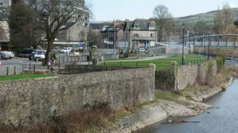 BBC Western side of the riverbank of the River Kent in Kendal town centre