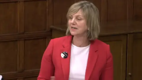 Parliament TV Minister for local transport Lilian Greenwood standing talking during a Westminster Hall debate