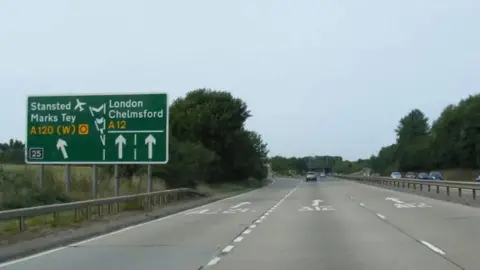 Picture of the A12 with a road sign for Marks Tey