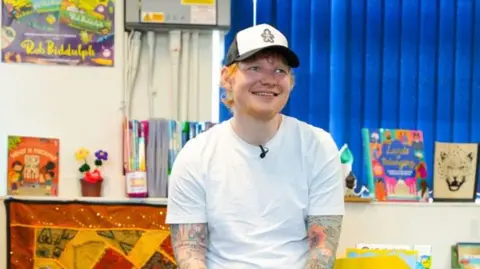 Sadie Avard / @sas.tudios Ed Sheeran at Fairlight Primary and Nursery School in Brighton