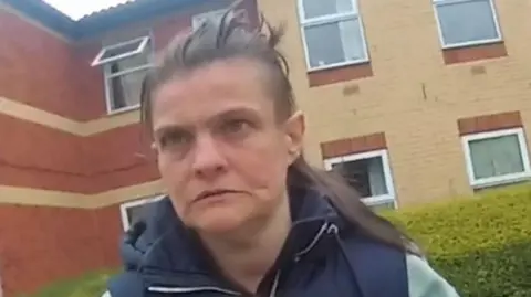 South Yorkshire Police A woman with brown hair wearing a blue gilet