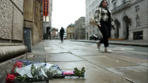 Reuters Flowers left in tribute on Water Street, where a car plowed into a crowd of Liverpool fans during a parade