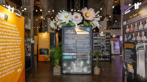 Karen Massey Photography The inside of a church has a collection of displays talking about the history of the festival. 