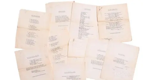 Fieldings Auctioneers Several pieces of paper, yellowed with age, with type that is too distant to read.