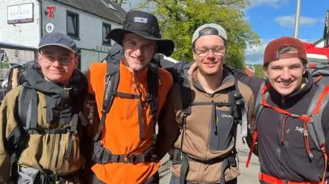 Pic of German walkers wearing hiking gear and back packs.