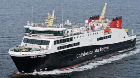 A black and white ship with red funnels