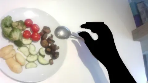 A picture of a persons plate with new potatoes, cucumber, mushrooms, tomatoes and broccoli.