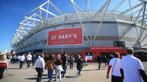 PA Media File photo of St Mary's Stadium in Southampton with fans outside.