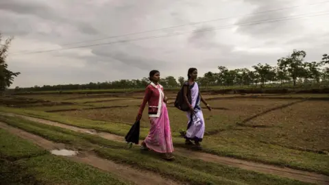 Getty Images Women who work on a tea plantation in Assam, India, April 8, 2015.