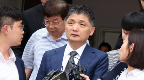 Kakao founder Kim Beom-su arriving at the Seoul Southern District Court last month.