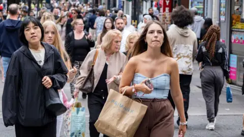 Getty Images Shoppers connected  Oxford Street