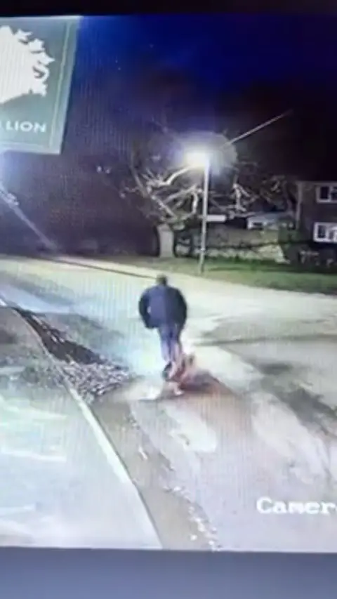 Man riding an e-scooter about to fall.