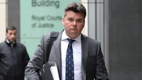 PA Media Dominic Chappell walking outside the High Court in London