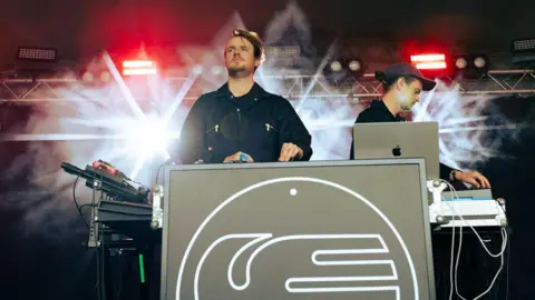 DJs playing a set on stage.