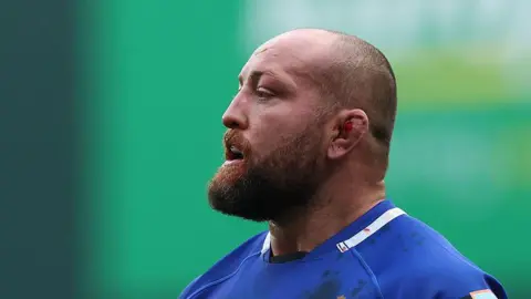 Tom Dunn wearing the blue shirt of Bath against Leicester Tigers in October