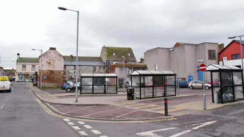Richard Dorrell A bus stance in Annan with lots of shelters