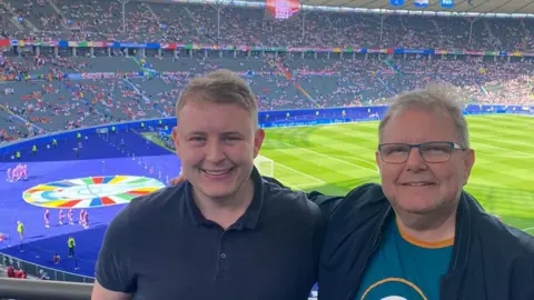 Liam Wilson Jack Pittman and his dad Andrew at the game in Berlin