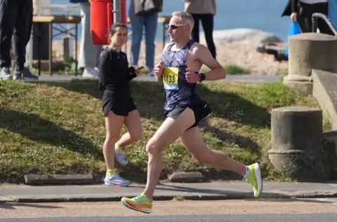 Eddie Mitchell A runner in action at the Worthing Half Marathon 2025.