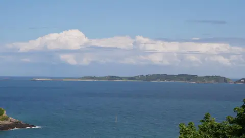 Guernsey sea views with other islands in background.