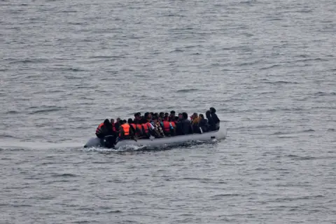 Reuters Migrants at sea in the English Channel in an inflatable boat