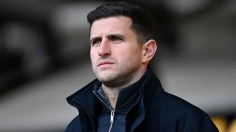 Portsmouth manager John Mousinho during the League One match between Port Vale and Portsmouth at Vale Park