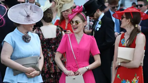 NEIL HALL/EPA/Shutterstock Race-goers attend the first day of Royal Ascot.