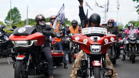Hairy Biker Si King (L) at the National Motorcycle Museum in Solihull, as he and thousands of others ride on motorbikes from London to Barrow. They are clad in biking gear and helmets.