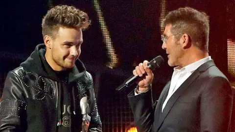 Getty Images Liam Payne dan Simon Cowell