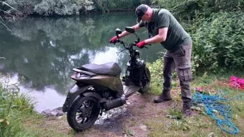 Peterborough and District Angling Association Volunteer with the bike