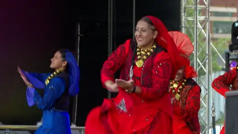 Indian lady dancer on stage in red