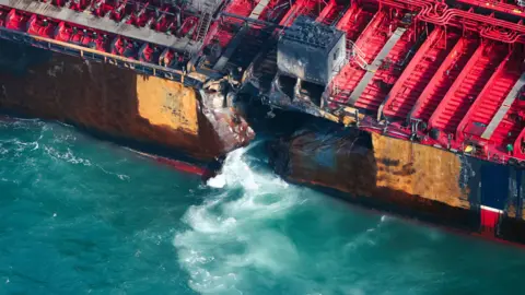 Part of the red Stena Immaculate ship which is damaged and letting water in. 