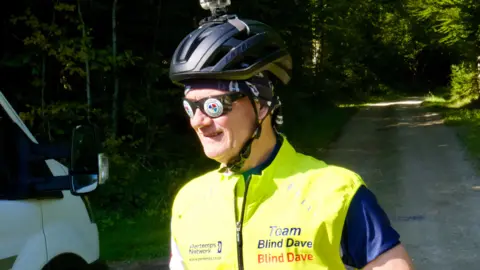 Man with cycling helmet and glasses