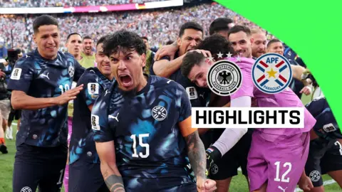 The Paraguay team celebrate beating Germany in a penalty shootout