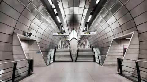 Historic England Archive The steel-panelled tunnel leading to the platforms. 