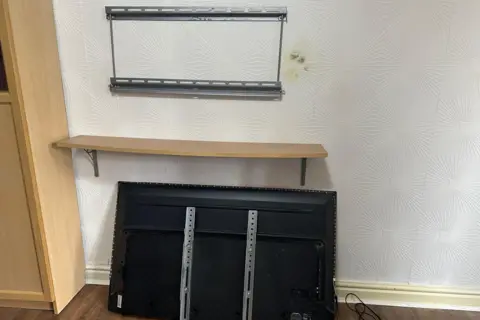 Images shows a mark on the wall where the television was