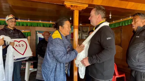 CPR campaigner David Sullivan being thanked by the locals in Mount Everest.