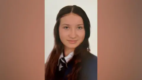 Durham Police Scarlett in her school uniform with her long brown hair on her shoulders