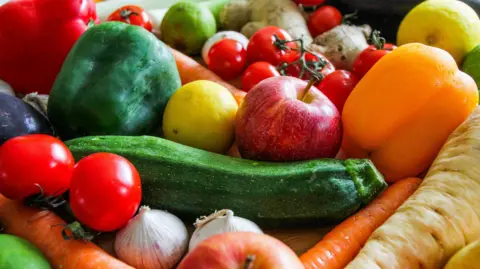 An up-close shot of lots of fruit and veg. 