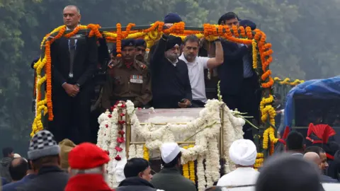 Mourners in the funeral convoy for Singh 