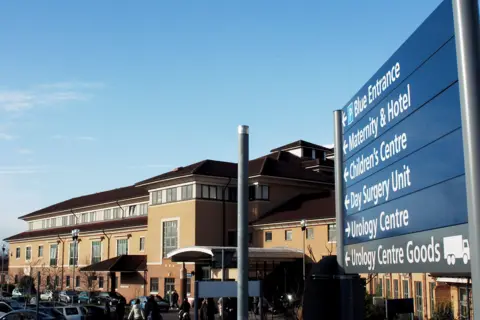 PA A hospital sign and building