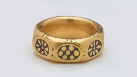 British Museum Undated handout photo issued by the British Museum of a gold ring with a black-coloured pattern on it from the ninth century that was part of a £3m Viking hoard.