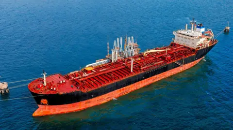 An oil tanker on a blue sea