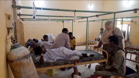 People being treated at a hospital in Sudan.