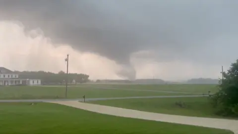 A tornado visible on the horizon
