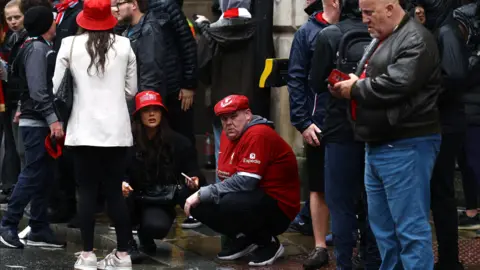 Reuters Onlookers following the Liverpool parade car incident