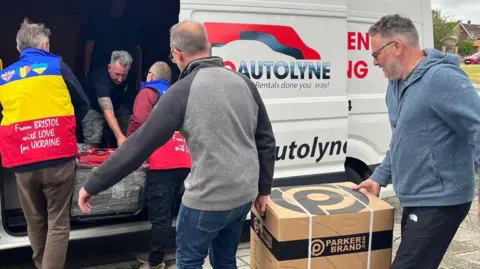 From Bristol with Love for Ukraine Men loading boxes into a truck