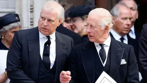 The former Prince Andrew and King Charles at a funeral in autumn 2025