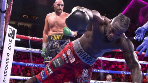 Deontay Wilder hits the canvas after a punch from Tyson Fury