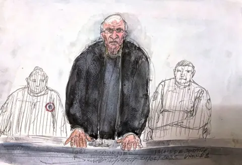 Getty Images This judicial sketch created on February 24, 2025 shows the retired surgeon Joel Le Scouarnec speaking during a hearing the opening day of his trial 