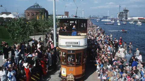 Trinity Mirror / Mirrorpix / Alamy A tram passes through packed crowds on the River Clyde as the Glasgow Garden festival launches in 1988